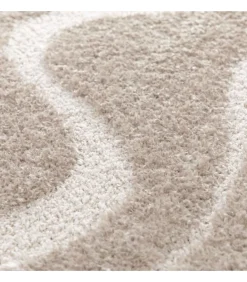 Hoogpolig vloerkleed met golvend patroon in taupe 120 x 170 cm
